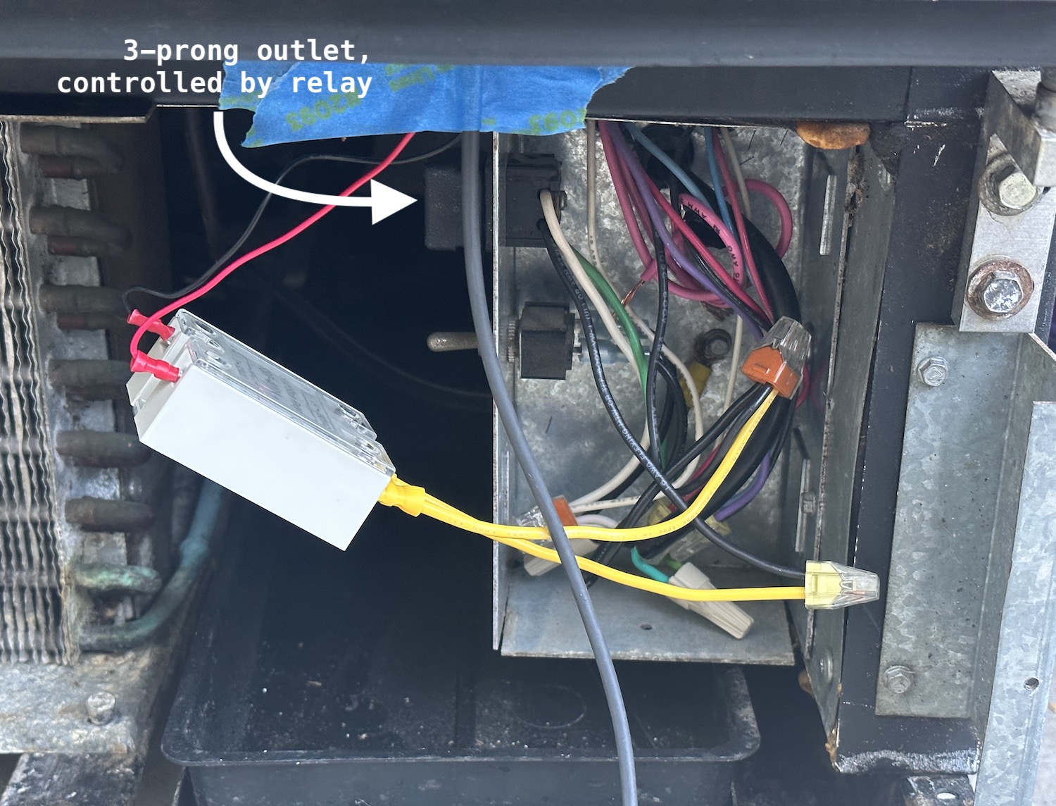 The relay installed near the wiring box for the rest of the fridge components.